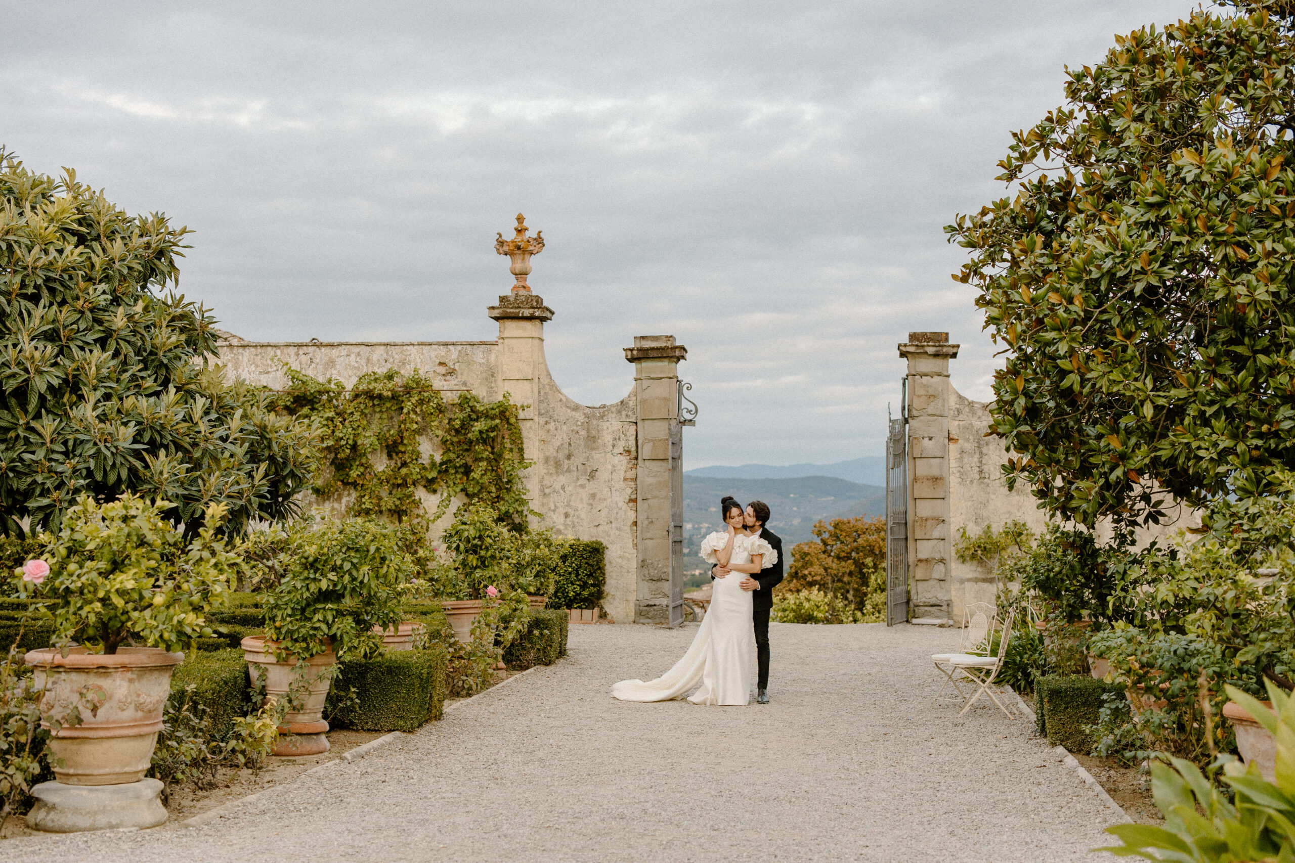 Wedding couple in the gardens at Villa Corsini in Tuscany Italy