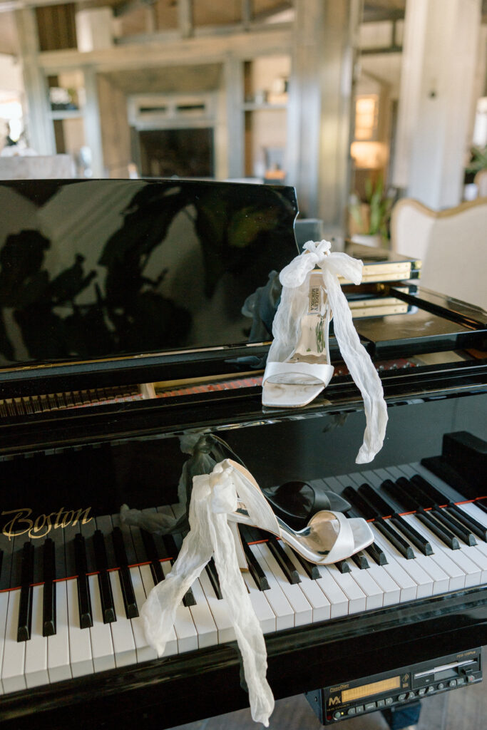 elegant wedding shoes on piano