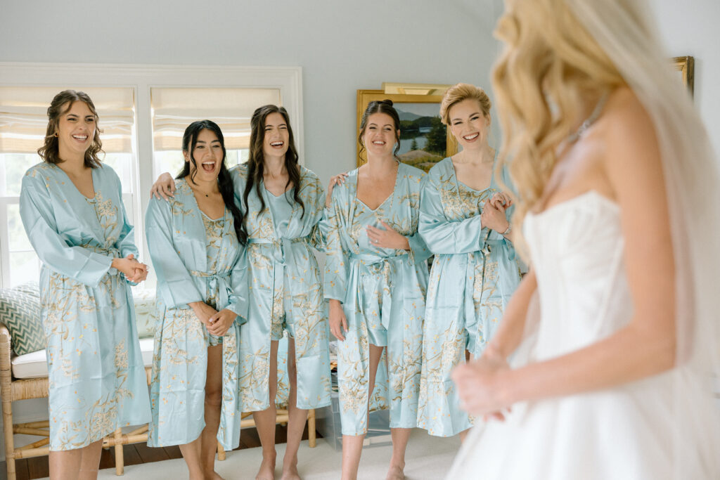 first look with bridesmaids and bride on wedding day