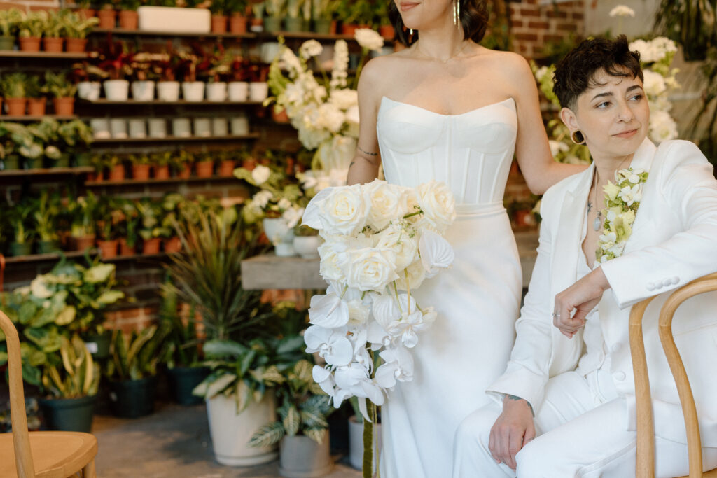 same sex wedding couple who worked with wedding planner for their garden wedding 