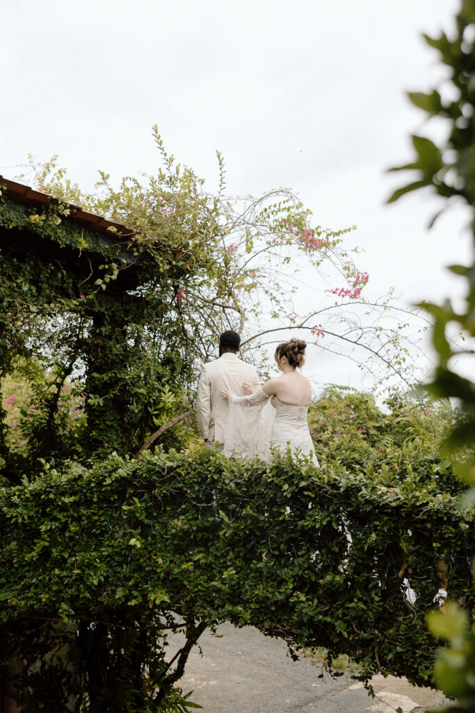 first look of bride and groom with tropical background at the Hacienda Siesta Alegre in Puerto Rico 