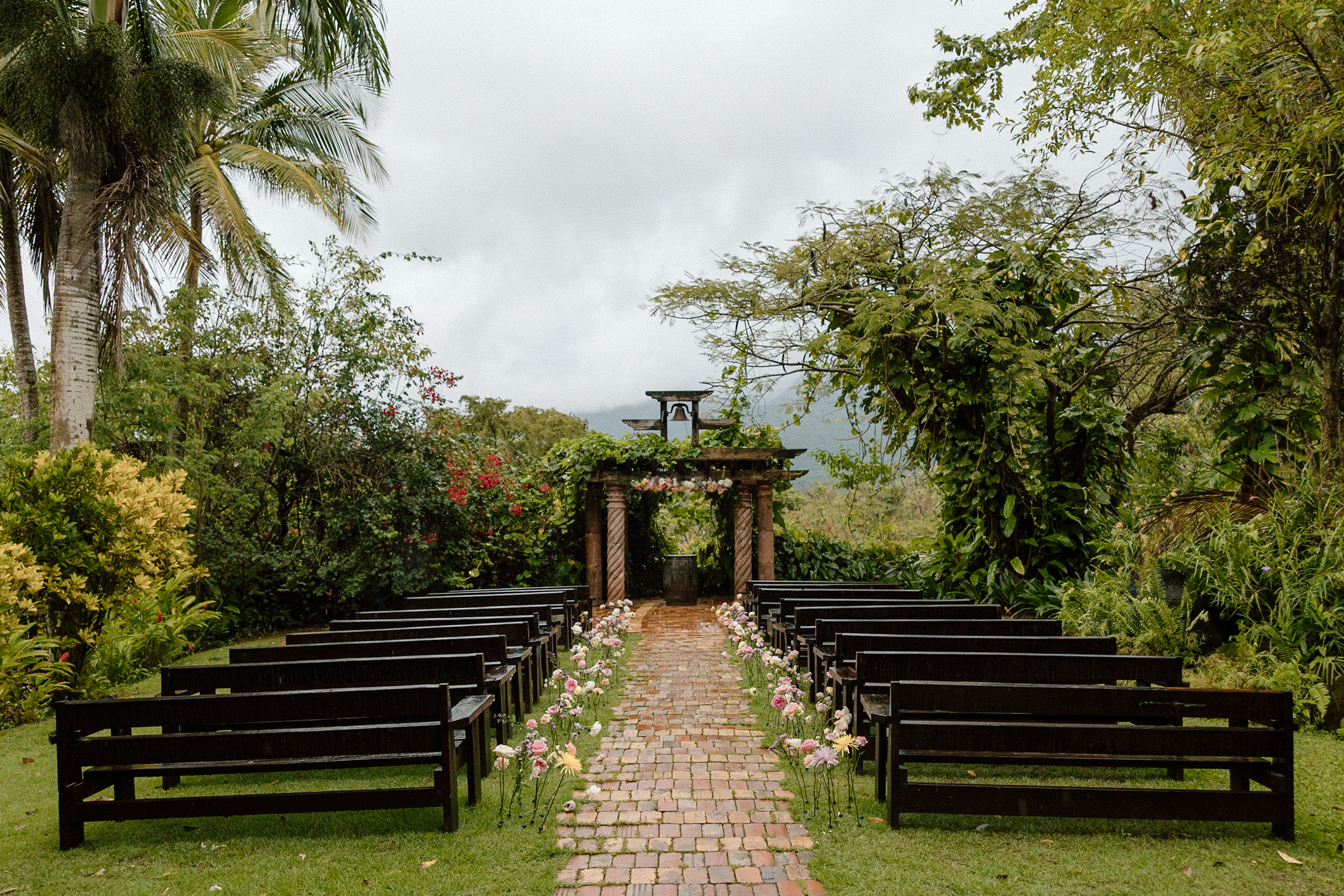 Ceremony Site of Puerto Rico Wedding with hand planted individual flowers along the aisle | Tropical Wedding Destination Wedding Photographer | Katelyn Bradley Photography