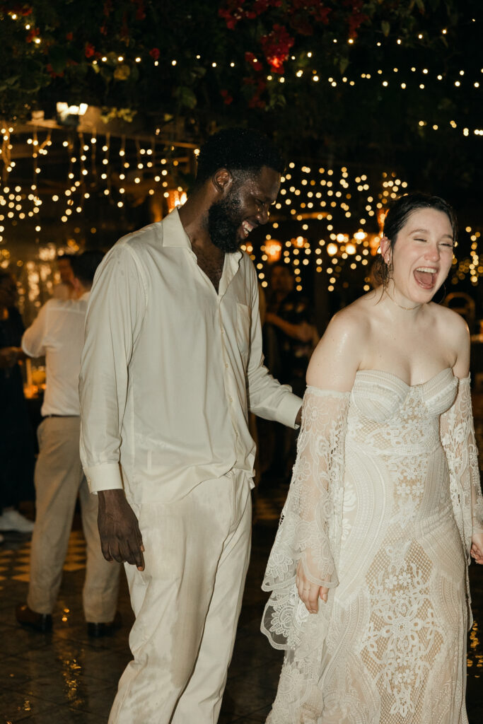 Late night dancing in the warm tropical rain on their wedding day in puerto rico 