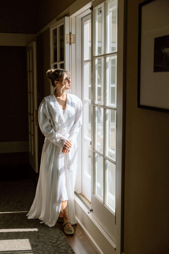 Tuscan-inspired Château St. Jean wedding venue in Sonoma Valley with arched windows, manicured gardens, and rolling vineyard views during a European-inspired California wedding.