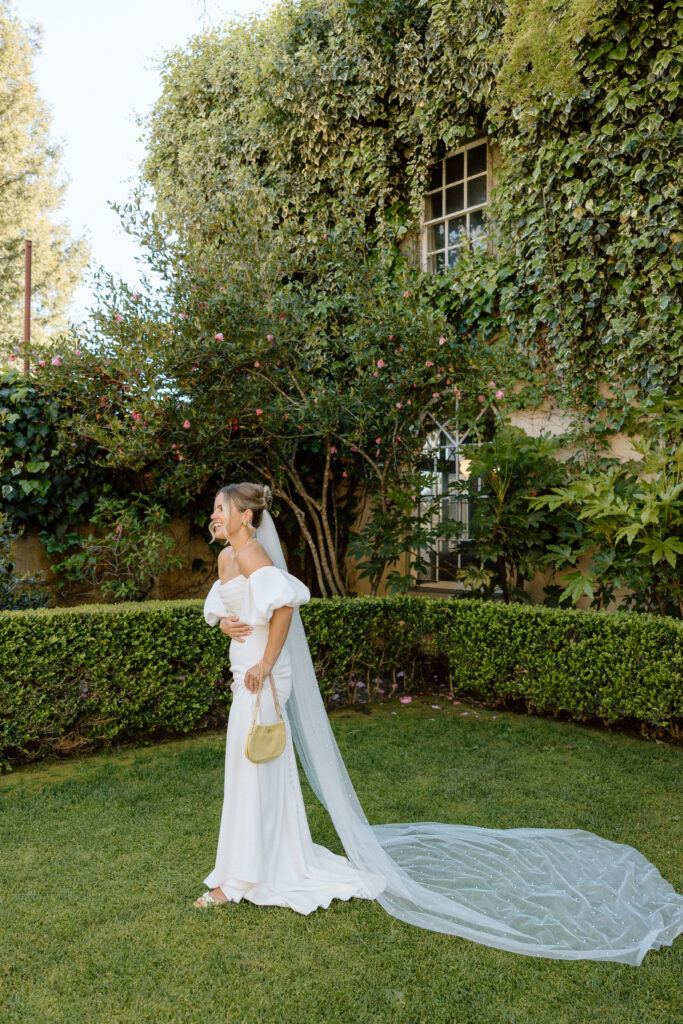 Tuscan-inspired Château St. Jean wedding venue in Sonoma Valley with arched windows, manicured gardens, and rolling vineyard views during a European-inspired California wedding.