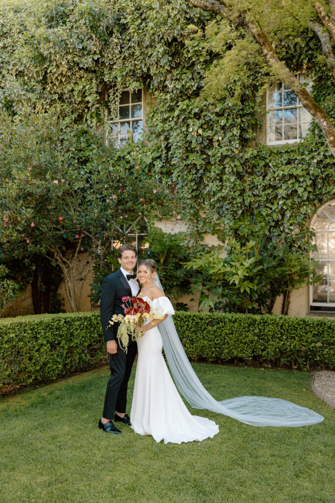 Tuscan-inspired Château St. Jean wedding venue in Sonoma Valley with arched windows, manicured gardens, and rolling vineyard views during a European-inspired California wedding.