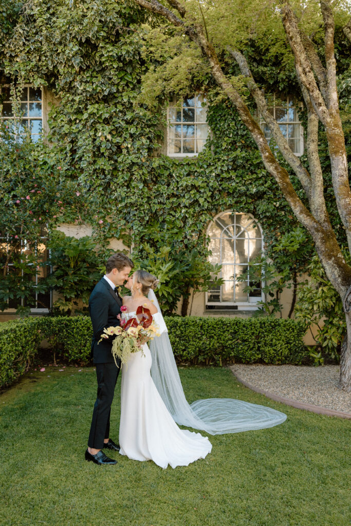Tuscan-inspired Château St. Jean wedding venue in Sonoma Valley with arched windows, manicured gardens, and rolling vineyard views during a European-inspired California wedding.