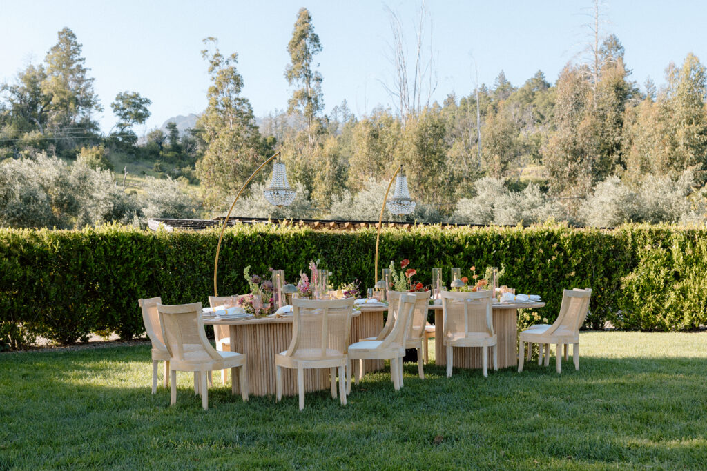 Editorial wedding reception at Château St. Jean with crystal chandeliers, calla lily place cards, and a wood-and-white checkered dance floor in Sonoma Valley.