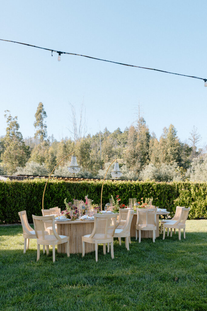 Editorial wedding reception at Château St. Jean with crystal chandeliers, calla lily place cards, and a wood-and-white checkered dance floor in Sonoma Valley.