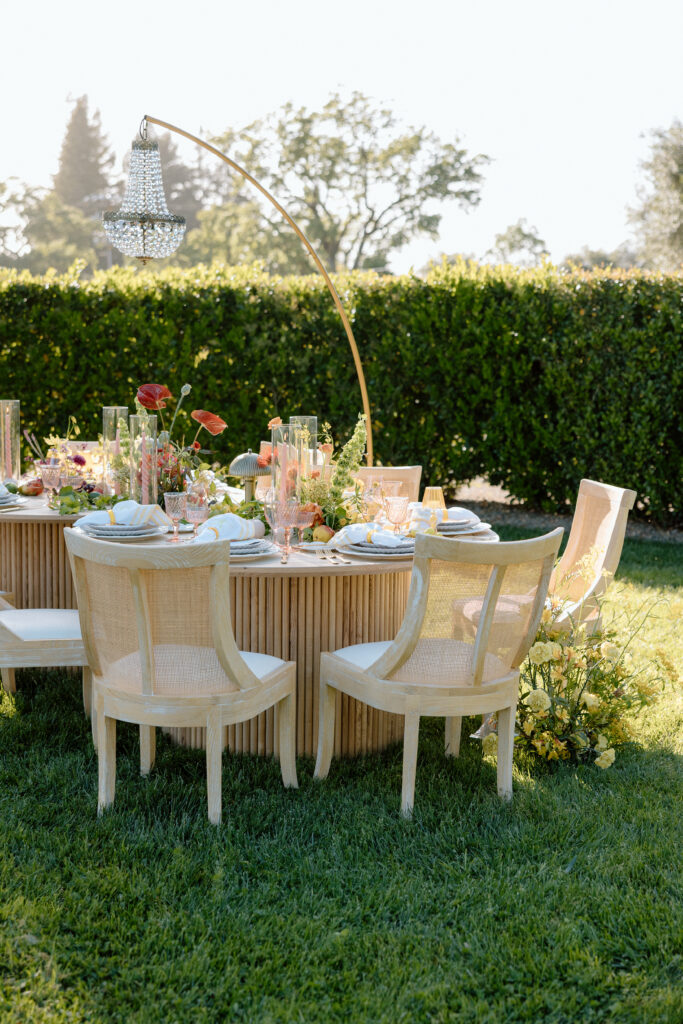 Editorial wedding reception at Château St. Jean with crystal chandeliers, calla lily place cards, and a wood-and-white checkered dance floor in Sonoma Valley.