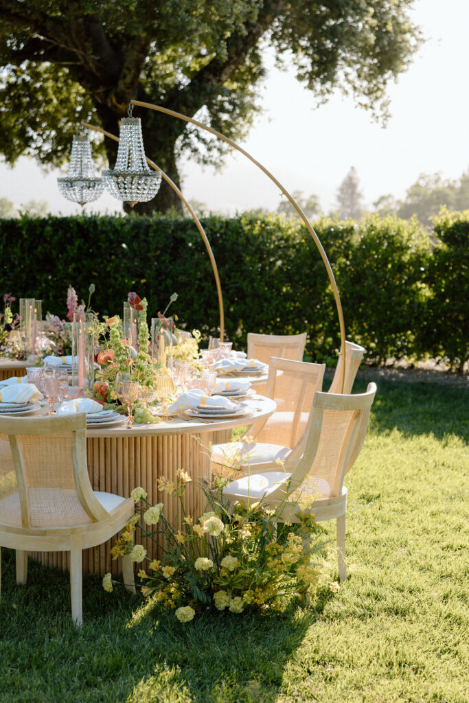 Editorial wedding reception at Château St. Jean with crystal chandeliers, calla lily place cards, and a wood-and-white checkered dance floor in Sonoma Valley.