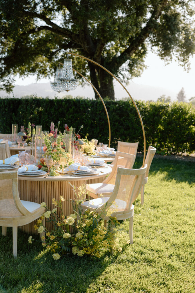 Editorial wedding reception at Château St. Jean with crystal chandeliers, calla lily place cards, and a wood-and-white checkered dance floor in Sonoma Valley.