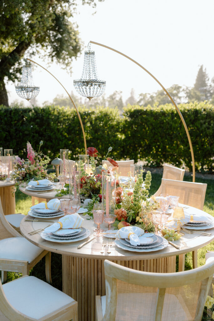 Editorial wedding reception at Château St. Jean with crystal chandeliers, calla lily place cards, and a wood-and-white checkered dance floor in Sonoma Valley.