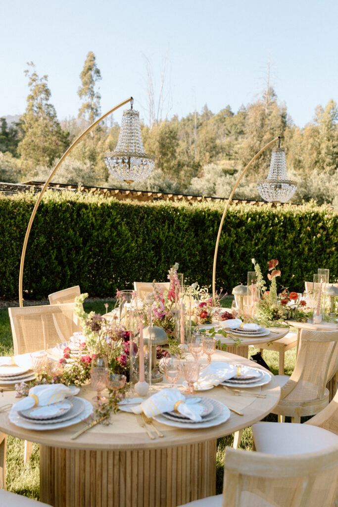 Editorial wedding reception at Château St. Jean with crystal chandeliers, calla lily place cards, and a wood-and-white checkered dance floor in Sonoma Valley.