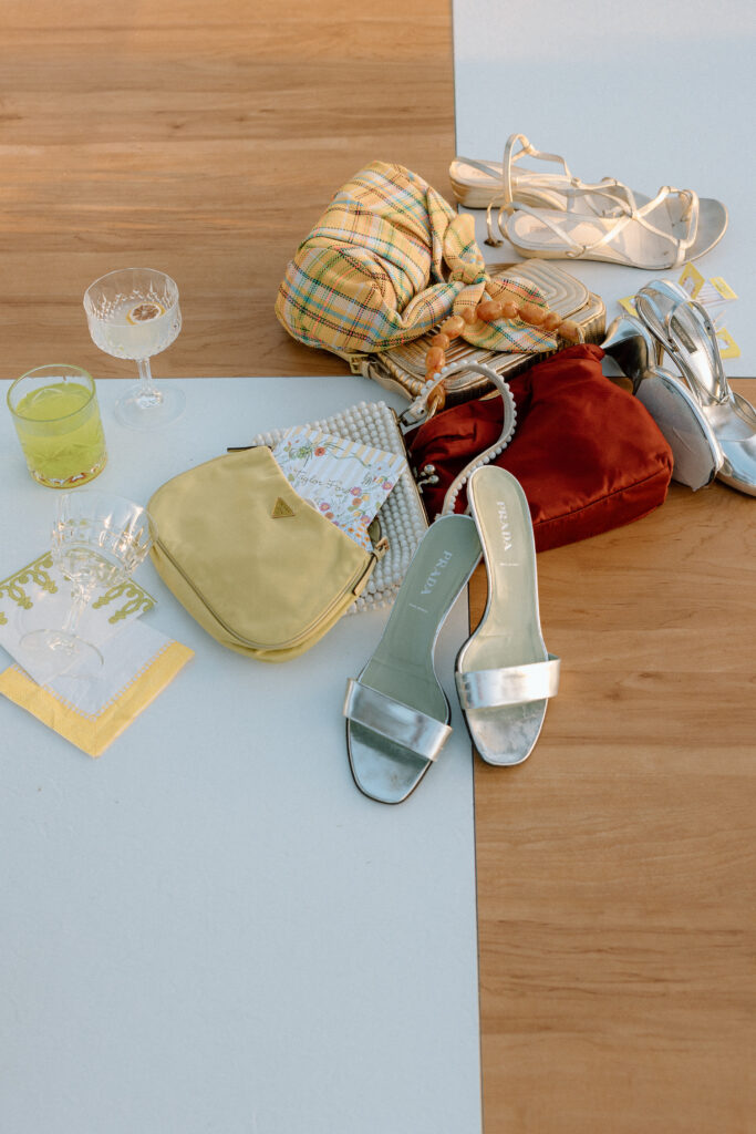 Bride and bridesmaids styled in European-inspired fashion, featuring rust and chartreuse dresses with vintage accessories at an editorial wedding at Château St. Jean.