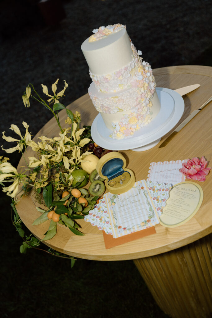 Bride and groom celebrating beside an artistic wedding cake at Château St. Jean during a European-inspired California wedding reception.