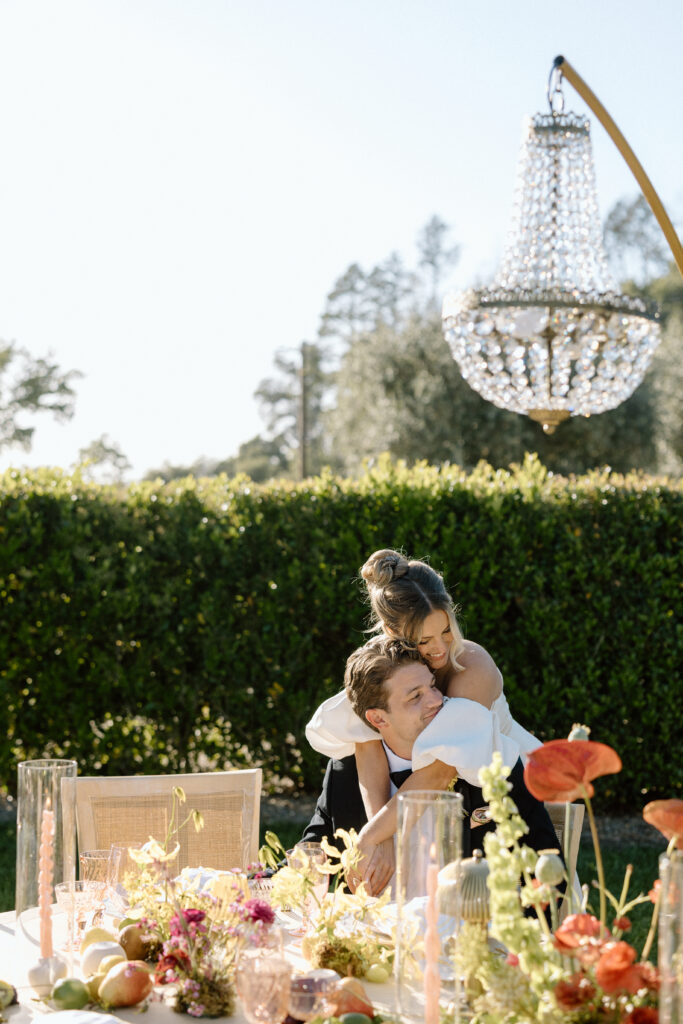 Editorial wedding reception at Château St. Jean with crystal chandeliers, calla lily place cards, and a wood-and-white checkered dance floor in Sonoma Valley.