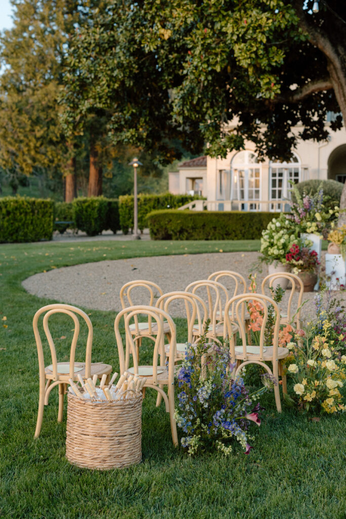 Romantic outdoor wedding ceremony at Château St. Jean with flowing florals, arched architecture, and vineyard backdrops inspired by European destination weddings.