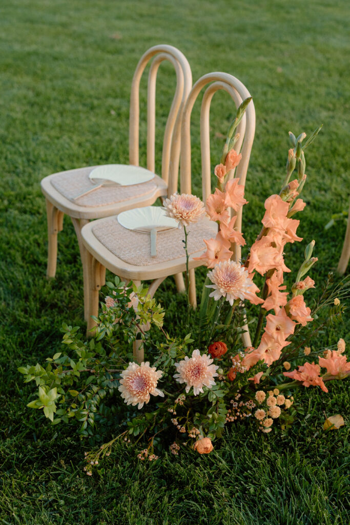 Romantic outdoor wedding ceremony at Château St. Jean with flowing florals, arched architecture, and vineyard backdrops inspired by European destination weddings.