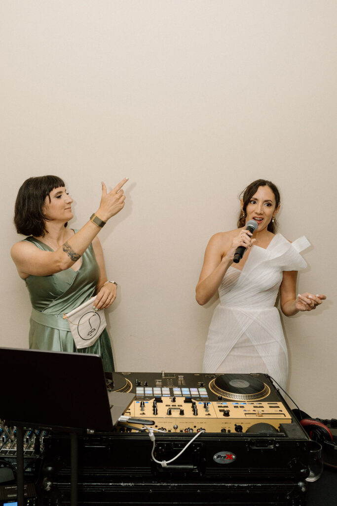 Bride performing a surprise song during the reception at her Northern California sailboat wedding