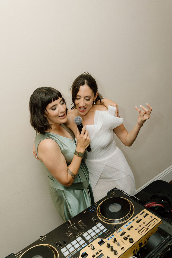 Bride performing a surprise song during the reception at her Northern California sailboat wedding