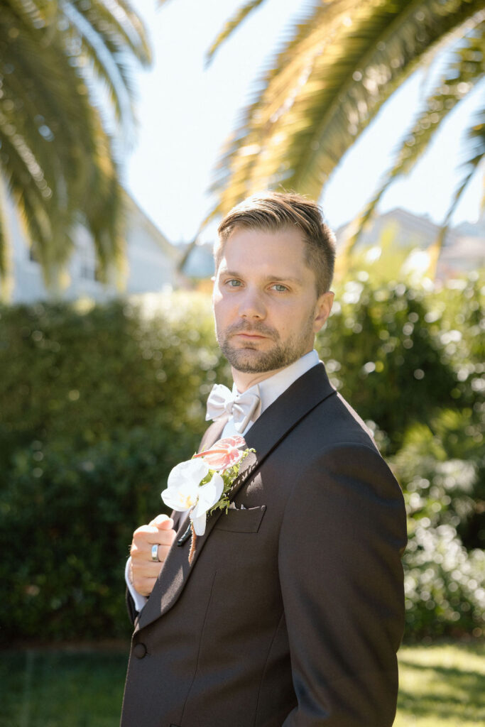 Groom preparing for his wedding day before the ceremony at a San Francisco Bay sailboat wedding