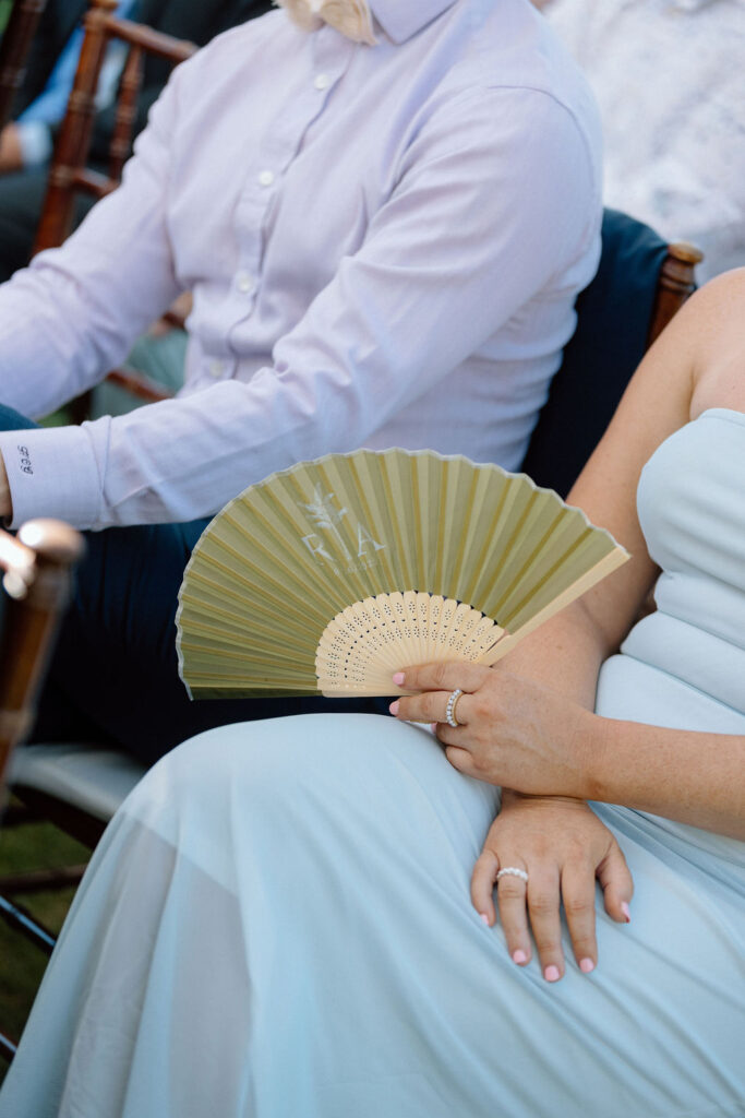 Bride and groom exchanging vows during an outdoor ceremony at Glen Cove Marina, surrounded by palm trees and sailboats in Northern California