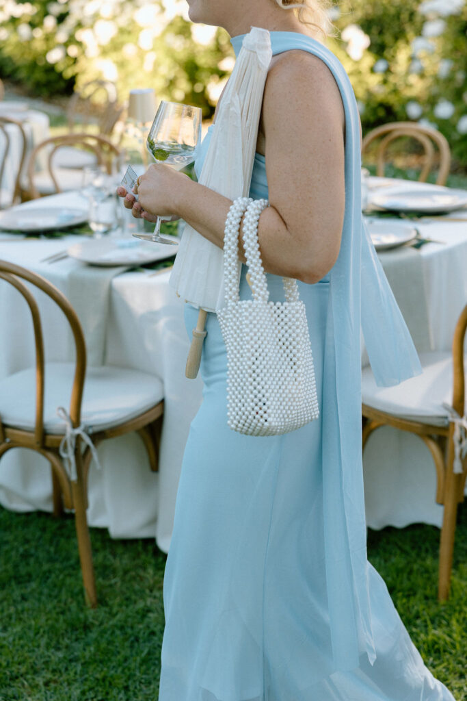 Golden hour reception beneath palm trees at a Northern California waterfront wedding