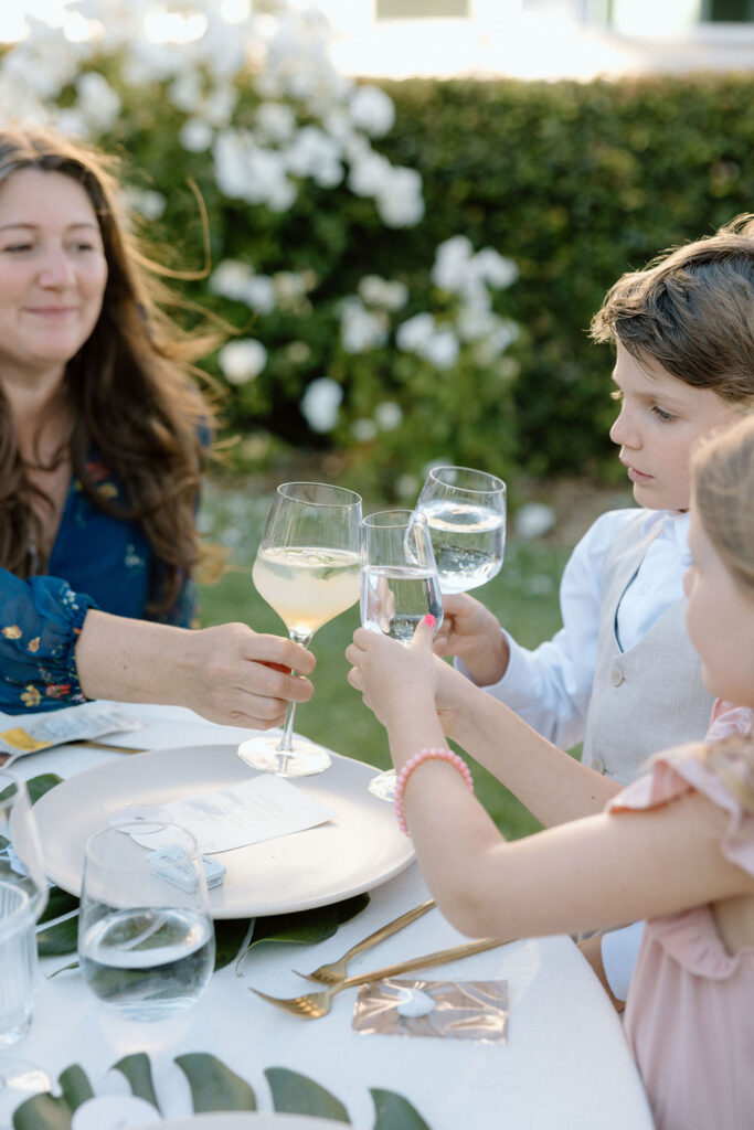 Golden hour reception beneath palm trees at a Northern California waterfront wedding