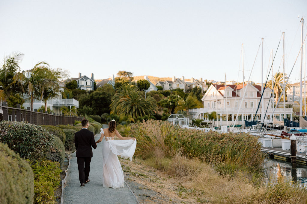 Coastal wedding with sailboat entrance into cocktail hour and elevated details