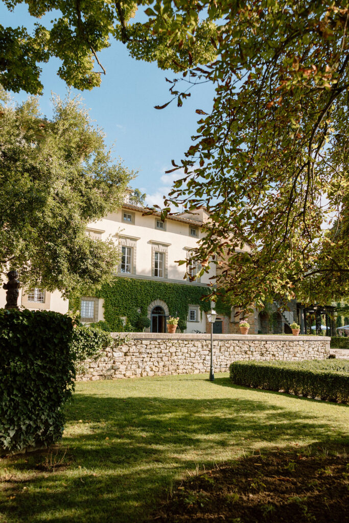 Luxury Renaissance villa in Tuscany with terracotta roofs, olive groves, and panoramic countryside views at Hotel Villa di Piazzano.