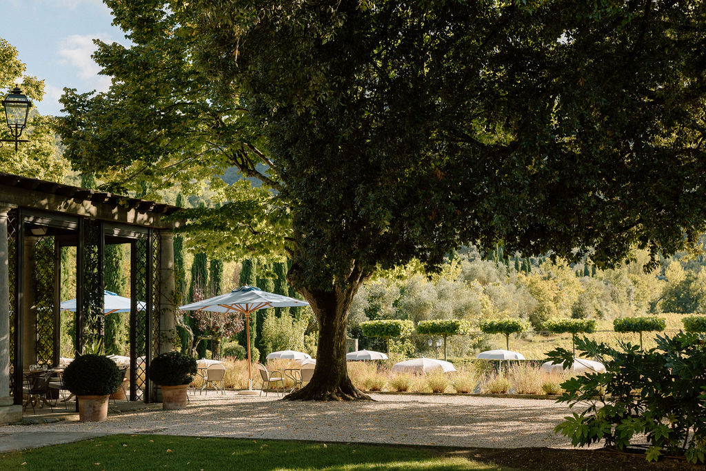 Luxury Renaissance villa in Tuscany with terracotta roofs, olive groves, and panoramic countryside views at Hotel Villa di Piazzano.