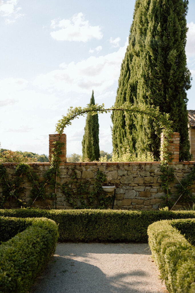 Luxury Renaissance villa in Tuscany with terracotta roofs, olive groves, and panoramic countryside views at Hotel Villa di Piazzano.