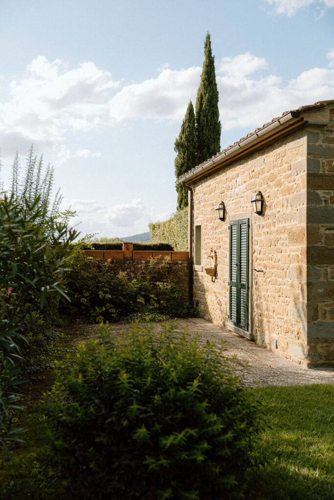 Luxury Renaissance villa in Tuscany with terracotta roofs, olive groves, and panoramic countryside views at Hotel Villa di Piazzano.