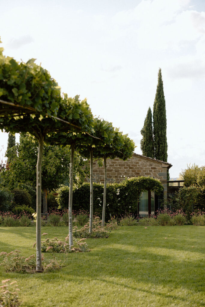 Luxury Renaissance villa in Tuscany with terracotta roofs, olive groves, and panoramic countryside views at Hotel Villa di Piazzano.