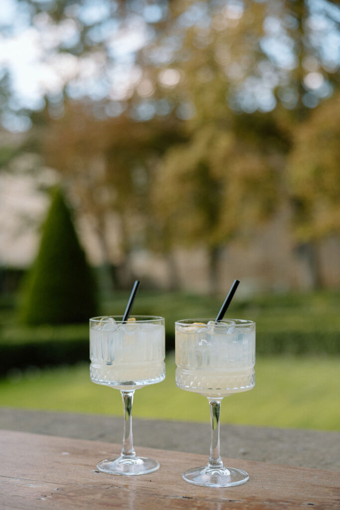 Private wine and hors d’oeuvres celebration in a secluded garden patio at Villa di Piazzano during a destination wedding weekend.