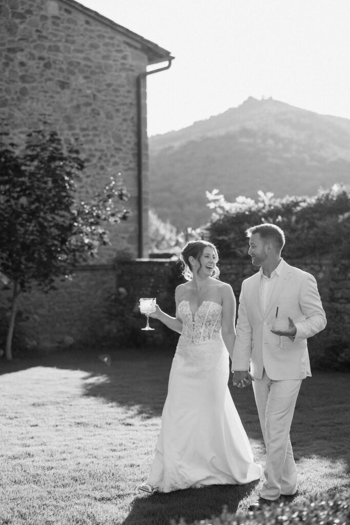 Private wine and hors d’oeuvres celebration in a secluded garden patio at Villa di Piazzano during a destination wedding weekend.