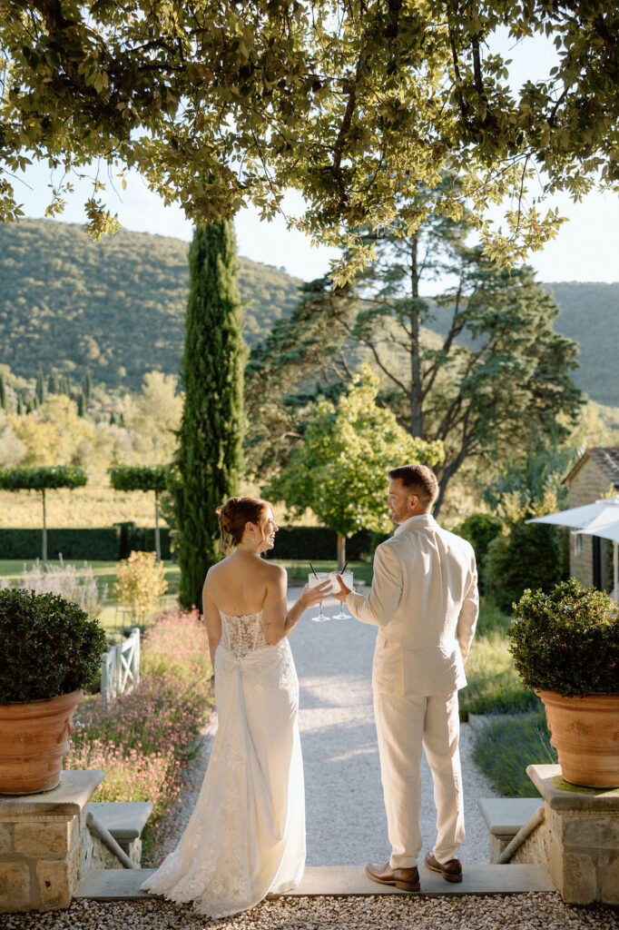 Private wine and hors d’oeuvres celebration in a secluded garden patio at Villa di Piazzano during a destination wedding weekend.