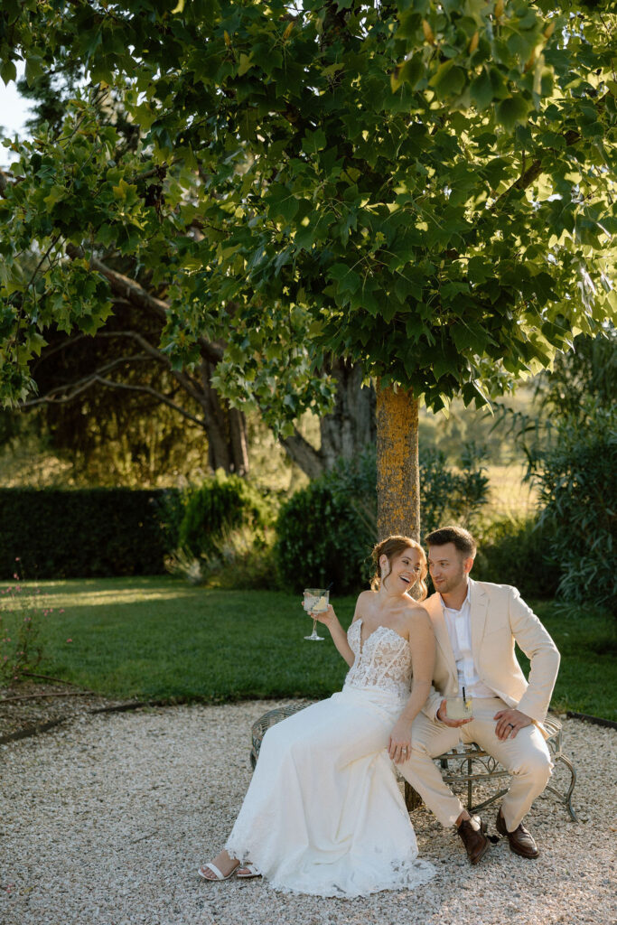 Private wine and hors d’oeuvres celebration in a secluded garden patio at Villa di Piazzano during a destination wedding weekend.