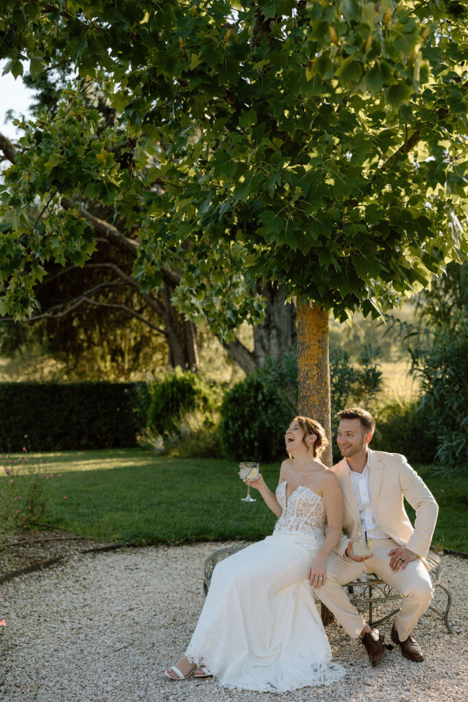 Private wine and hors d’oeuvres celebration in a secluded garden patio at Villa di Piazzano during a destination wedding weekend.