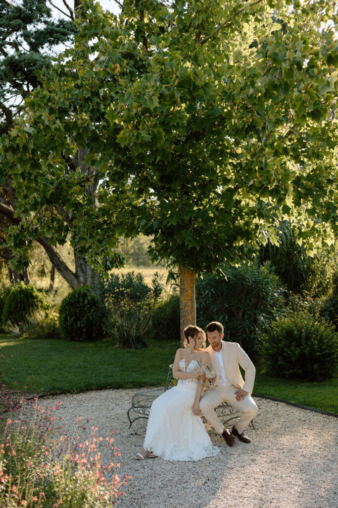 Private wine and hors d’oeuvres celebration in a secluded garden patio at Villa di Piazzano during a destination wedding weekend.