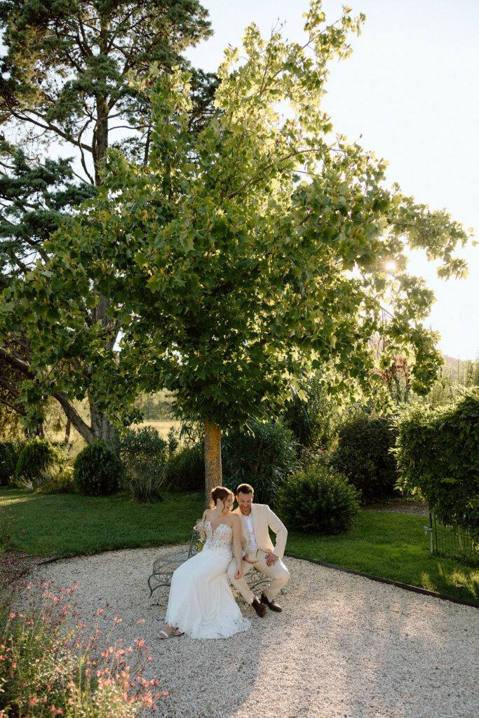 Private wine and hors d’oeuvres celebration in a secluded garden patio at Villa di Piazzano during a destination wedding weekend.