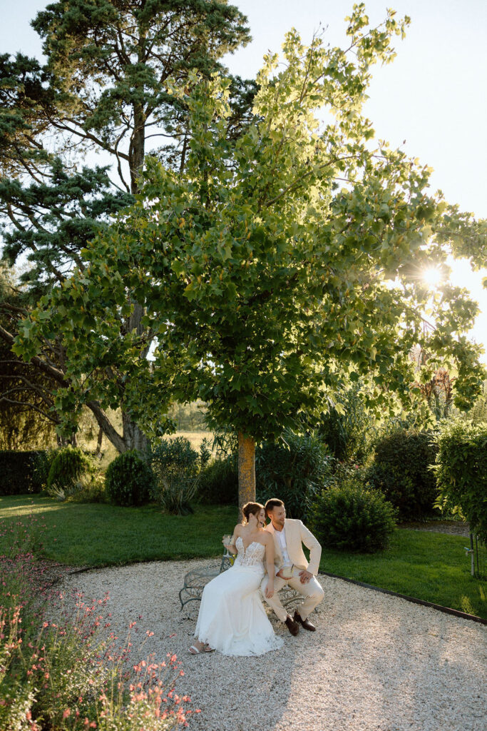 Private wine and hors d’oeuvres celebration in a secluded garden patio at Villa di Piazzano during a destination wedding weekend.