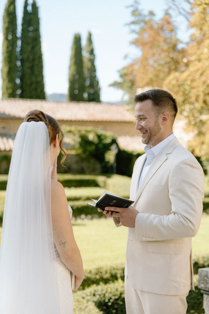 Emotional private vow exchange beneath olive trees at Villa di Piazzano during an intimate destination wedding in Italy.