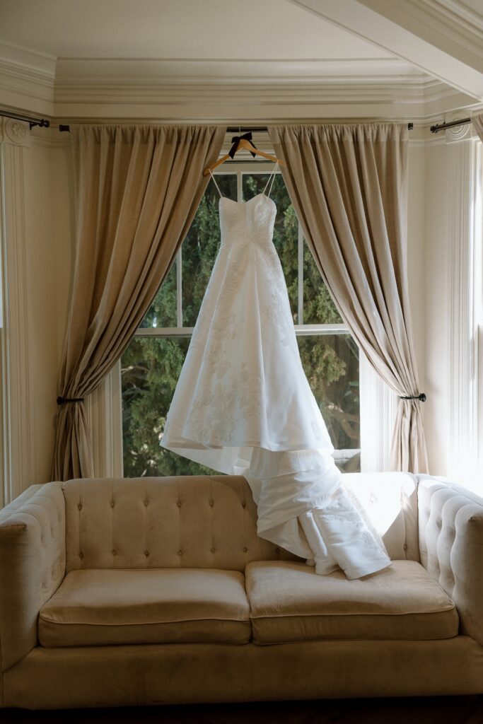 Wedding dress hanging in window at Park Winters in California