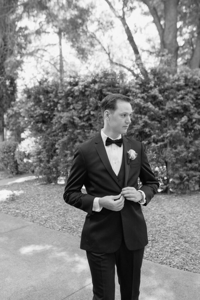 Editorial walking photo of groom on wedding day 
