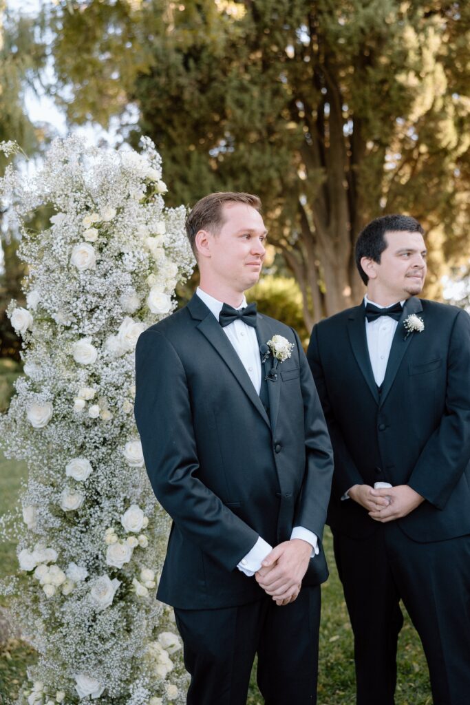 Groom tears up as he watches his bride walk down the aisle captured by california wedding photographer