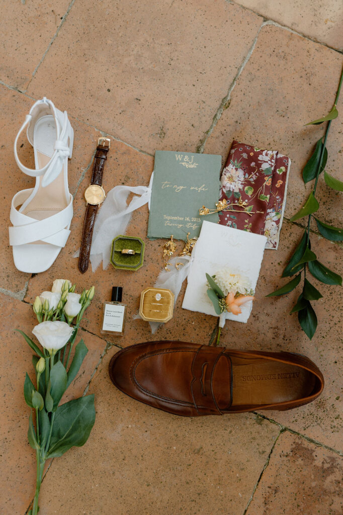 Flat lay of details designed by Piper designs for Tuscany Wedding