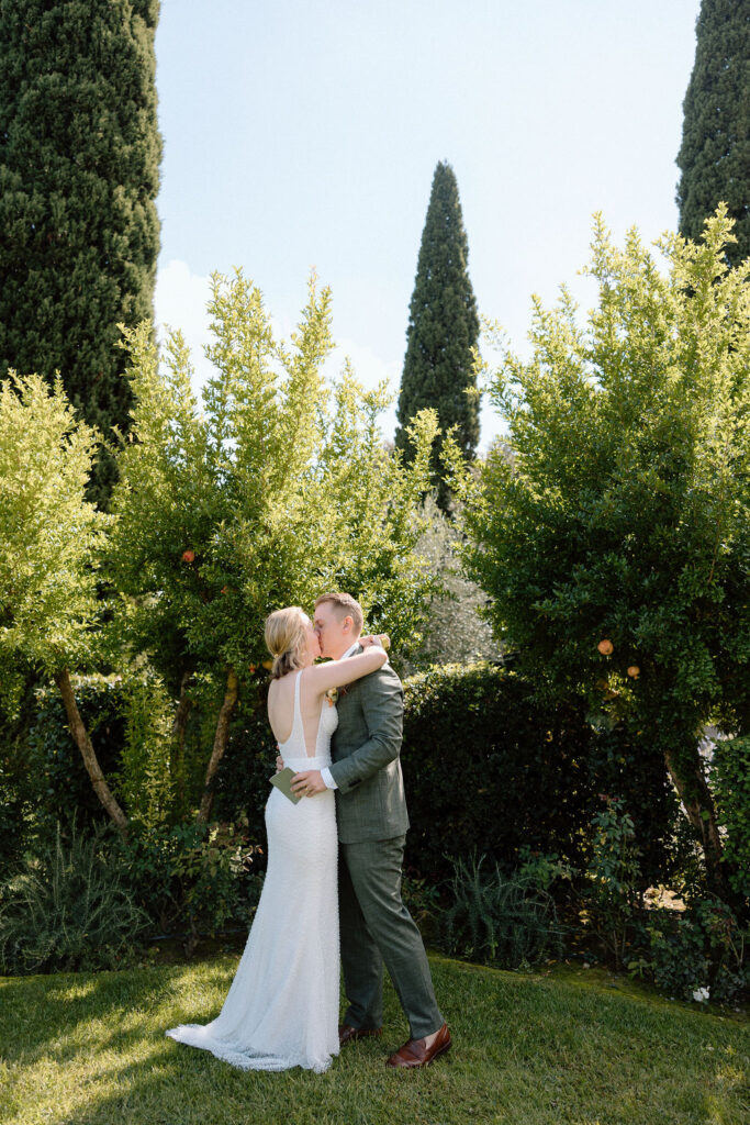 Bride and groom eloping in the rolling olive groves and sweeping countryside of Tuscany with natural light creating a timeless feel.
