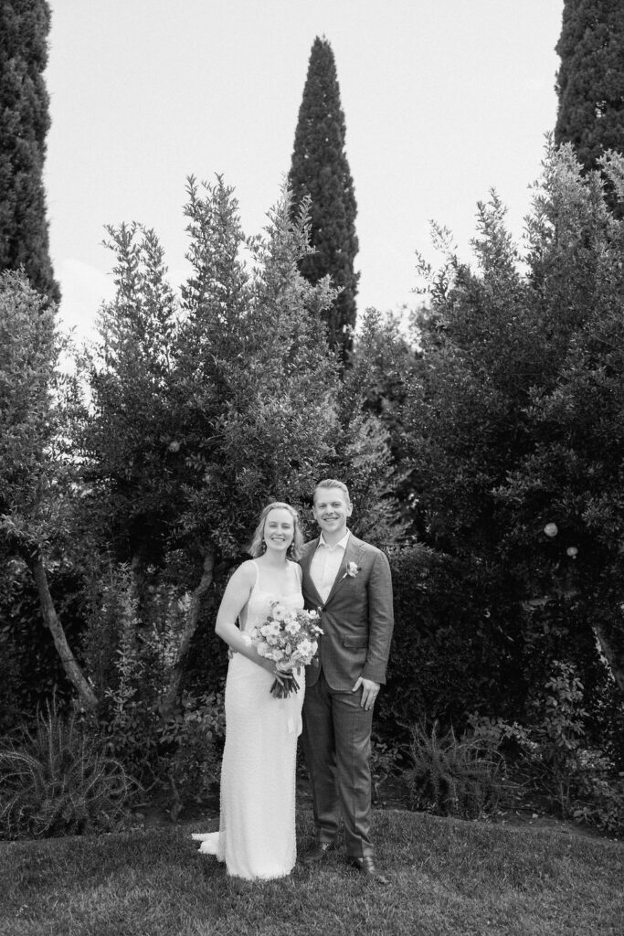 Emotional destination wedding ceremony in Tuscany as the couple shares vows in a quiet, meaningful setting.